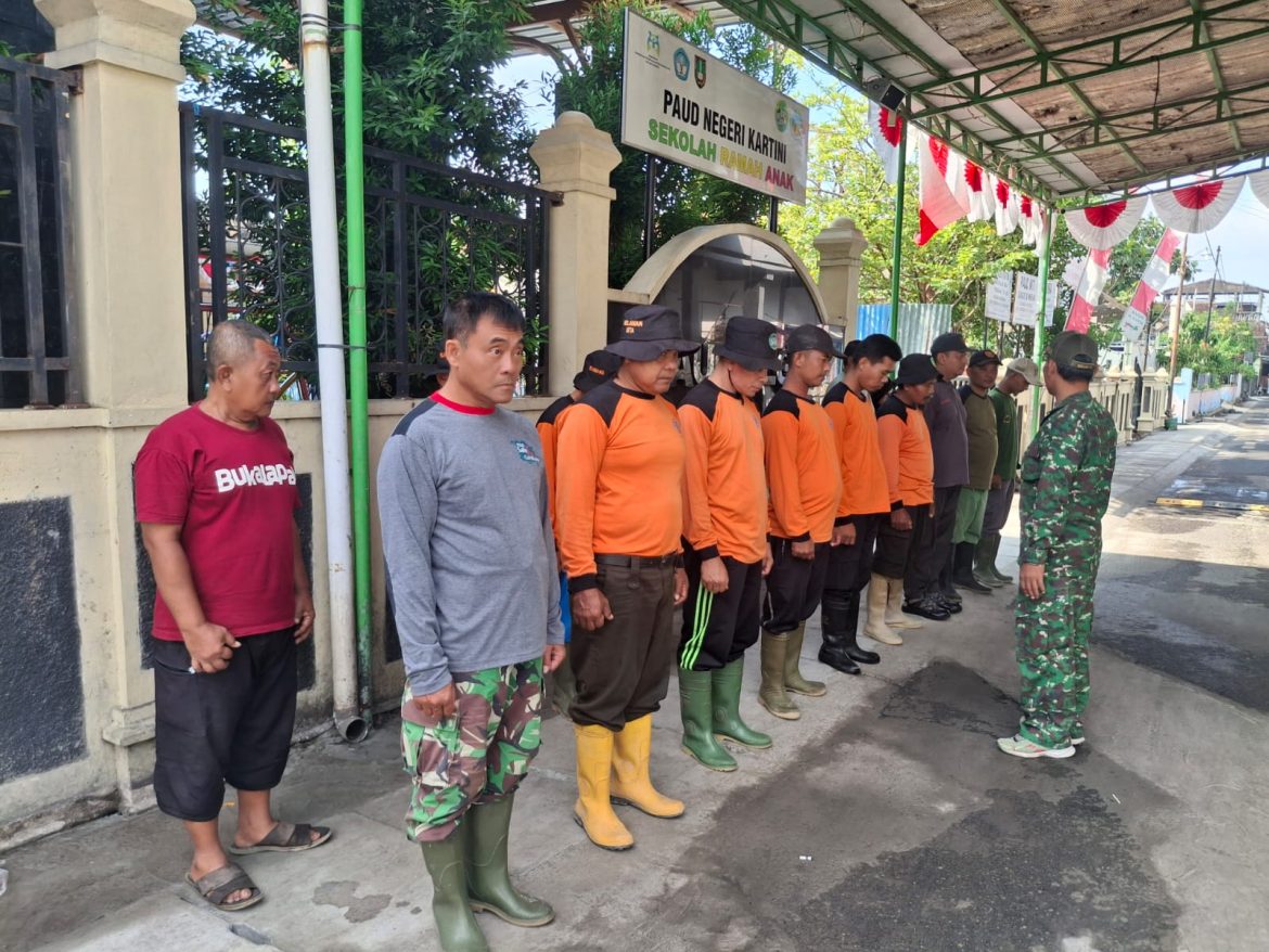 Guyub Rukun, Satgas KBD Ke-5 TA. 2025 Kodim 0735/Surakarta akhiri dengan Pengecatan Lis Jalan dan Penutup Saluran Air.